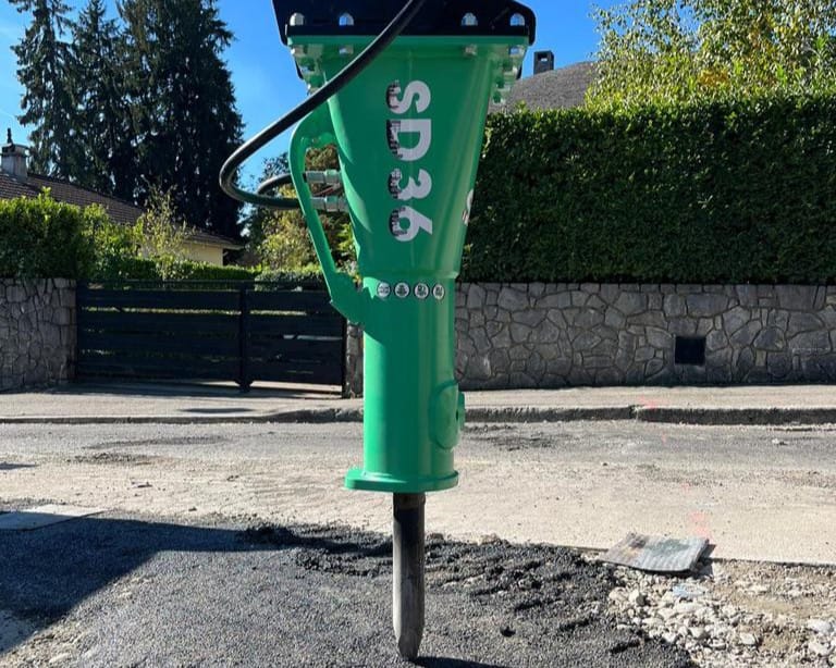 Montabert SD36 compact breaker working on concrete