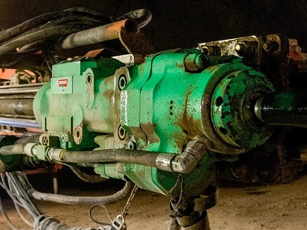 Montabert hydraulic drifter mounted on a drilling rig