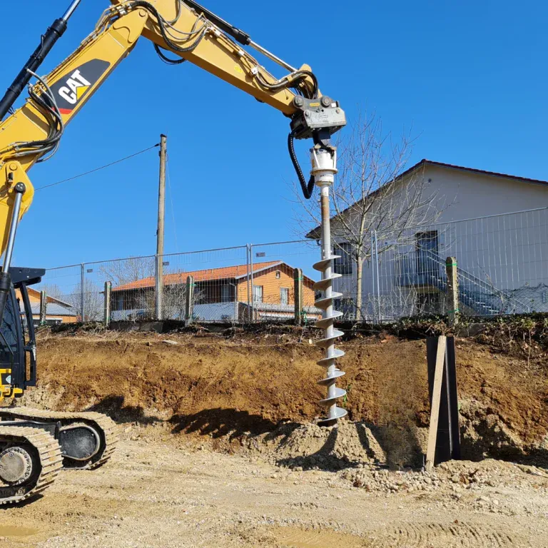 Kemroc EBA auger drive drilling on a CAT excavator