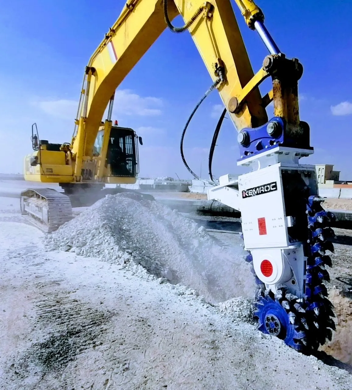 Kemroc EK chain cutter on a yellow Komatsu excavator cutting limestone